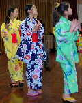 Japanese girls wearing kimonos at a bon-odori festival