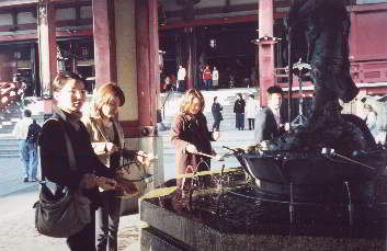Purifying hands outside Japanese temple